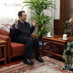 温总理：更好地传承和发扬光大少数民族文化艺术
